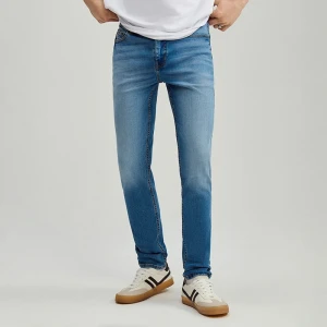 Niebieskie jeansy slim fit z efektem sprania House