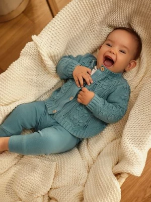 Niebieskie legginsy niemowlęce z falbankami na nogawkach 5.10.15.