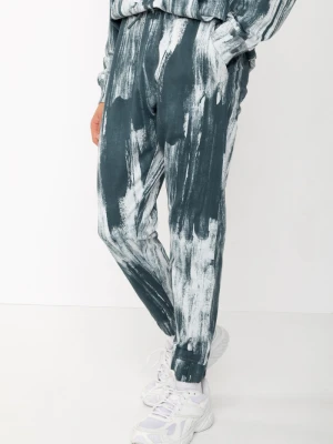 Niebieskie spodnie dresowe z nadrukiem tie dye Reporter