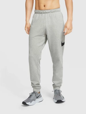 Nike Spodnie dresowe w kolorze szarym rozmiar: M