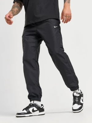 Nike Spodnie Nrg Nocta Cs Trk Wvn czarny