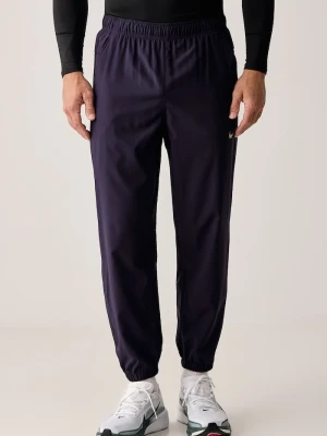 Nike spodnie treningowe męskie Form Dri-FIT fioletowy