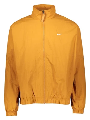 Nike Sportswear Kurtka sportowa "Solo Swoosh Woven" w kolorze pomarańczowym rozmiar: S