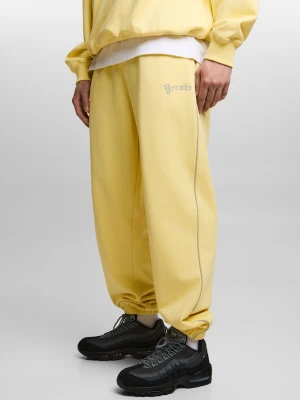 Nine spodnie dresowe oversize męskie żółte Klasyk