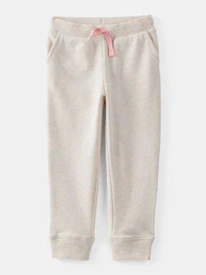 OshKosh Spodnie dresowe w kolorze kremowym rozmiar: 104