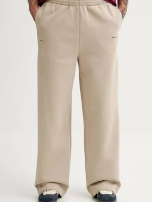 Pangaia spodnie dresowe bawełniane kolor beżowy gładkie 10002676