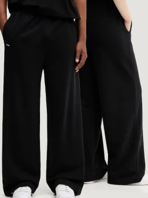 Pangaia spodnie dresowe bawełniane kolor czarny z nadrukiem 10002080
