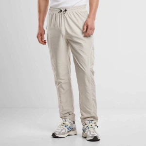Urban Classics Piped Panel Trackpants mężczyźni Spodnie dresowe beż rozmiar Odzież