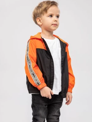 Pomarańczowa kurtka typu wiatrówka dla chłopca z kapturem Minoti