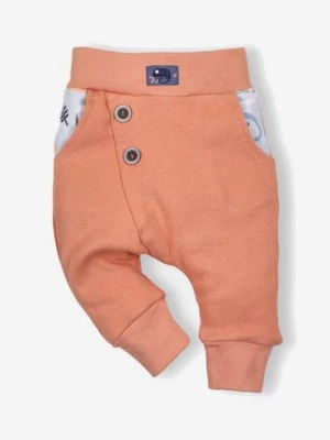 Pomarańczowe dwuwarstwowe spodnie z bawełny organicznej dla chłopca NINI