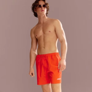 Pomarańczowe szorty kąpielowe z haftem House