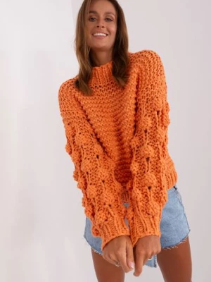 Pomarańczowy sweter oversize z grubym splotem