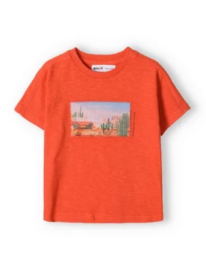 Pomarańczowy t-shirt bawełniany dla chłopca z nadrukiem Minoti