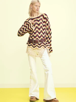 Postrzępione dżinsowe spodnie z rozszerzanymi nogawkami Desigual