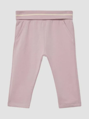 Przytulne spodnie unisex do biegania z wywijanym pasem s.Oliver różowy