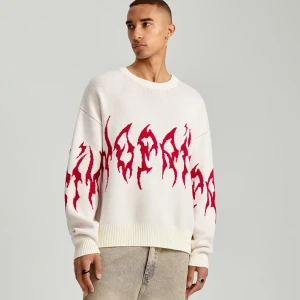 Pudełkowy sweter ze wzorem płomieni House