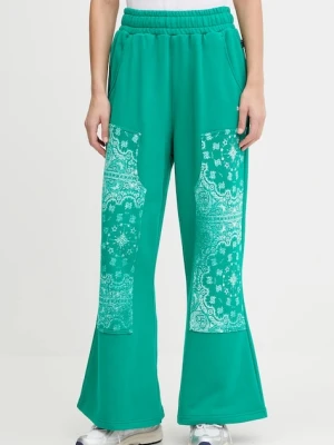 Puma spodnie dresowe bawełniane damskie kolor zielony wzorzyste 632845