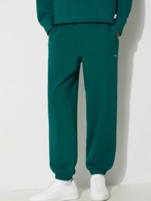 Puma spodnie dresowe bawełniane MMQ Sweatpants kolor zielony gładkie 624007