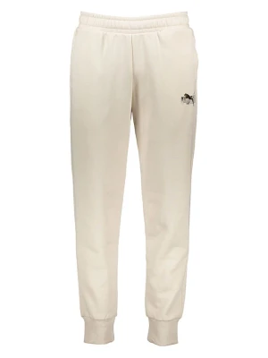 Puma Spodnie dresowe "Essentials+" w kolorze beżowym rozmiar: M