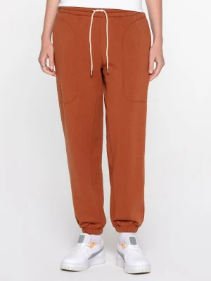 Puma Spodnie dresowe "Infuse" w kolorze jasnobrązowym rozmiar: M