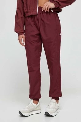 Reebok Classic spodnie dresowe kolor bordowy gładkie