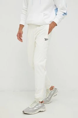 Reebok Classic spodnie dresowe męskie kolor beżowy z nadrukiem