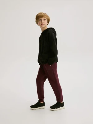Reserved - Bawełniane joggery z meszkiem - bordowy