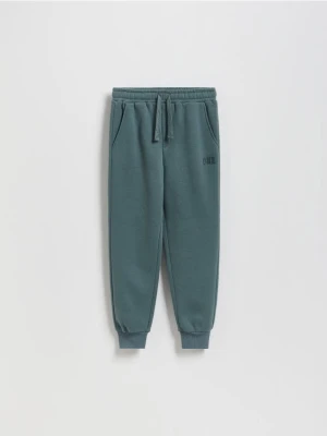 Reserved - Bawełniane joggery z meszkiem - zielony