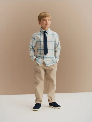 Reserved - Bawełniane spodnie chino - złamana biel