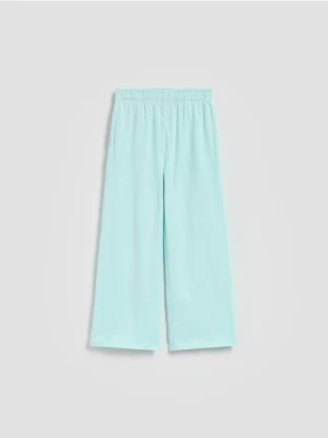Reserved - Bawełniane spodnie dresowe - jasnoturkusowy