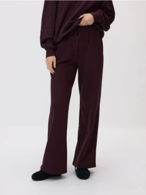 Reserved - Bawełniane spodnie dresowe - mahoniowy