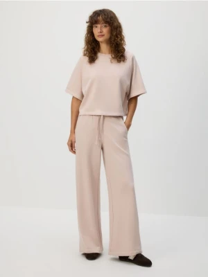 Reserved - Bawełniane spodnie dresowe - pastelowy róż