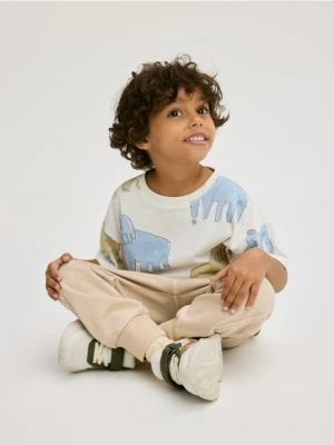 Reserved - Bawełniane spodnie jogger - beżowy