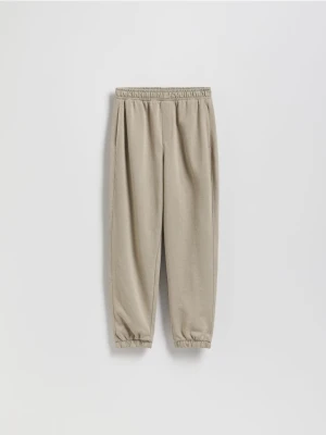 Reserved - Bawełniane spodnie jogger - beżowy