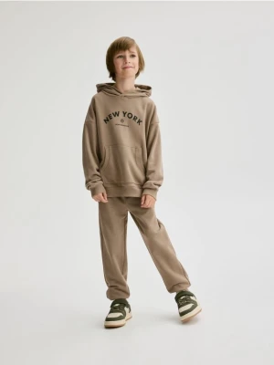 Reserved - Bawełniane spodnie jogger - brązowy