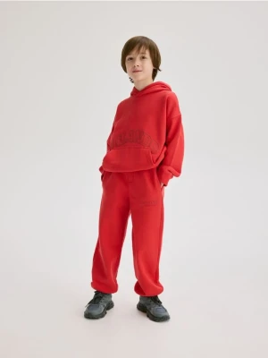 Reserved - Bawełniane spodnie jogger - czerwony
