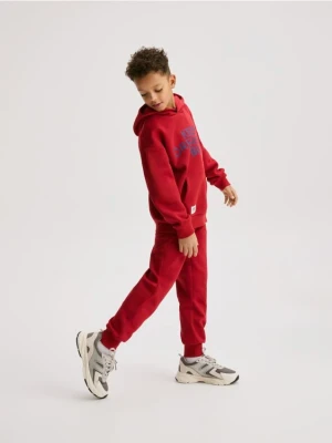 Reserved - Bawełniane spodnie jogger - czerwony