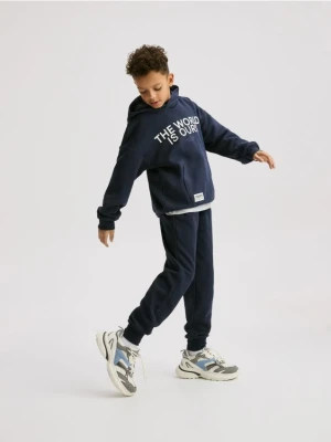 Reserved - Bawełniane spodnie jogger - granatowy