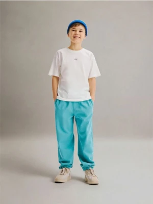 Reserved - Bawełniane spodnie jogger - miętowy