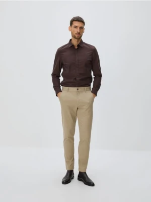 Reserved - Bawełniane spodnie slim fit - beżowy