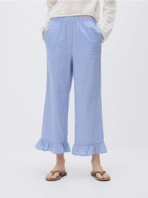 Reserved - Bawełniane spodnie z falbanką - jasnoniebieski