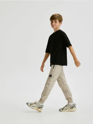 Reserved - Bawełniane spodnie z kieszeniami - beżowy