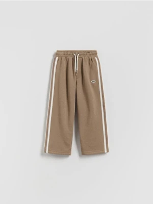 Reserved - Bawełniane spodnie z lampasami - brązowy