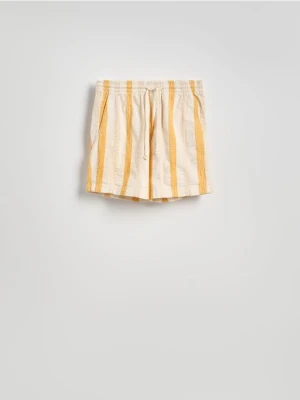 Reserved - Bawełniane szorty jogger - bursztynowy