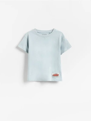 Reserved - Bawełniany t-shirt z naszywką - jasnoniebieski