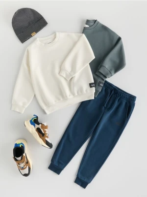 Reserved - Bluza oversize z nadrukiem - złamana biel