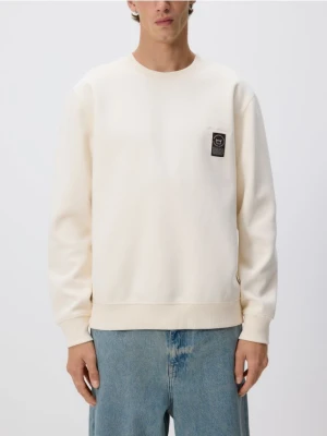 Reserved - Bluza z naszywką - złamana biel