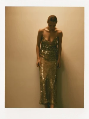 Reserved - Błyszcząca sukienka maxi - złoty