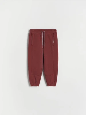 Reserved - Dresowe spodnie jogger - bordowy