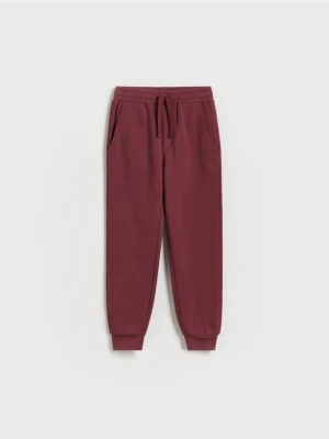 Reserved - Dresowe spodnie jogger - bordowy